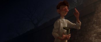 Movie still from “Ratatouille” (2007), directed by Jan Pinkava – An animated character in a chef's outfit holding a jar; Medium shot, Low angle