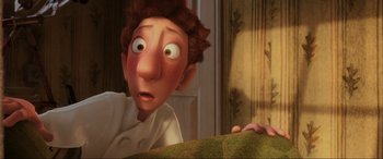 Movie still from “Ratatouille” (2007), directed by Jan Pinkava – An image of an animated character looking surprised; Close Up shot, Over the shoulder angle