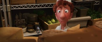 Movie still from “Ratatouille” (2007), directed by Jan Pinkava – An animated character looking surprised at a piece of cake; Close Up shot, Over the shoulder angle