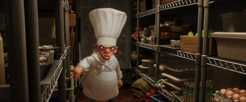 Movie still from “Ratatouille” (2007), directed by Jan Pinkava – An animated character in a chef's outfit in a kitchen; Medium shot, High angle