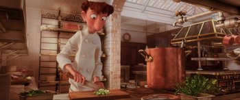 Movie still from “Ratatouille” (2007), directed by Jan Pinkava – An animated character in a kitchen preparing food; Medium shot, Low angle