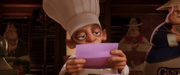 Movie still from “Ratatouille” (2007), directed by Jan Pinkava – An animated character looking at a piece of paper; Close Up shot, High angle
