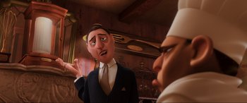 Movie still from “Ratatouille” (2007), directed by Jan Pinkava – A man in a suit talking to another man in a suit and tie; Medium shot, Over the shoulder angle