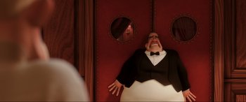 Movie still from “Ratatouille” (2007), directed by Jan Pinkava – A man laying on a bed in front of a mirror; Medium shot, Low angle