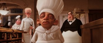 Movie still from “Ratatouille” (2007), directed by Jan Pinkava – An image of a cartoon character in a chef's outfit; Close Up shot, Low angle