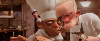 Movie still from “Ratatouille” (2007), directed by Jan Pinkava – Two cartoon characters in white hats one of which is a chef and one of which is an old man; Close Up shot, Over the shoulder angle