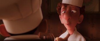 Movie still from “Ratatouille” (2007), directed by Jan Pinkava – An image of an animated character with a wine glass in his hand; Close Up shot, Over the shoulder angle