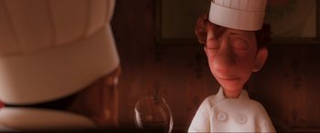 Movie still from “Ratatouille” (2007), directed by Jan Pinkava – A person wearing a white hat and a white shirt; Close Up shot, Over the shoulder angle