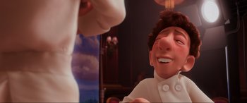 Movie still from “Ratatouille” (2007), directed by Jan Pinkava – A person's face in a room; Close Up shot, Over the shoulder angle