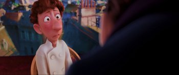 Movie still from “Ratatouille” (2007), directed by Jan Pinkava – An animated person is looking at another person in the background; Close Up shot, Over the shoulder angle