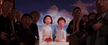 Movie still from “Ratatouille” (2007), directed by Jan Pinkava – A group of people standing around a table; Medium shot, Low angle