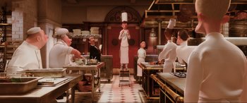 Movie still from “Ratatouille” (2007), directed by Jan Pinkava – A group of people in a kitchen preparing food; Wide shot, Low angle