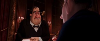 Movie still from “Ratatouille” (2007), directed by Jan Pinkava – A man in a suit and bow tie sitting next to another man; Medium shot, Over the shoulder angle