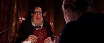 Movie still from “Ratatouille” (2007), directed by Jan Pinkava – A man in a suit holding a book in front of another man in a suit; Medium shot, Over the shoulder angle