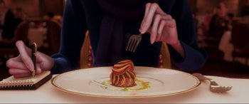 Movie still from “Ratatouille” (2007), directed by Jan Pinkava – A person holding a fork over a piece of food on top of a white plate; Extreme Close Up shot, Overhead angle