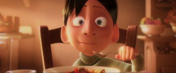 Movie still from “Ratatouille” (2007), directed by Jan Pinkava – A boy is sitting in front of a bowl of cereal; Close Up shot, Over the shoulder angle