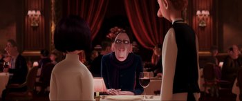 Movie still from “Ratatouille” (2007), directed by Jan Pinkava – An image of an animated character at a table with a glass of red wine; Medium shot, Over the shoulder angle