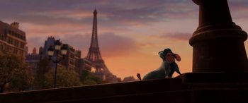 Movie still from “Ratatouille” (2007), directed by Jan Pinkava – A mouse sitting on top of a building in front of the eiffel tower; Wide shot, Low angle
