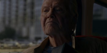 Movie still from “Ray Donovan: The Movie” (2022), directed by David Hollander – An old man with a beard is looking at the camera; Close Up shot, Low angle