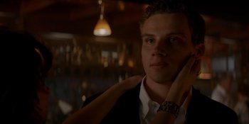 Movie still from “Ray Donovan: The Movie” (2022), directed by David Hollander – A man in a black jacket and a woman in a white shirt; Close Up shot, Low angle