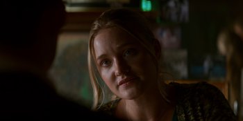 Movie still from “Ray Donovan: The Movie” (2022), directed by David Hollander – A person with long blonde hair; Close Up shot, Over the shoulder angle