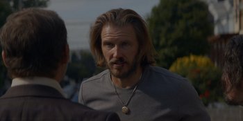 Movie still from “Ray Donovan: The Movie” (2022), directed by David Hollander – A person with long hair; Close Up shot, Over the shoulder angle