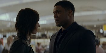 Movie still from “Ray Donovan: The Movie” (2022), directed by David Hollander – A man and a woman looking at one another; Close Up shot, Over the shoulder angle