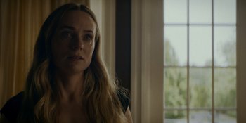 Movie still from “Ray Donovan: The Movie” (2022), directed by David Hollander – A woman with long blonde hair looking at the camera; Close Up shot, Low angle