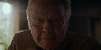 Movie still from “Ray Donovan: The Movie” (2022), directed by David Hollander – An old man with a white beard looking at the camera; Close Up shot, Low angle