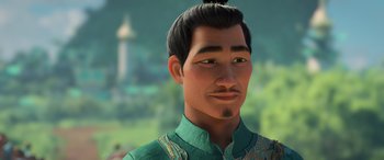 Movie still from “Raya and the Last Dragon” (2021), directed by Don Hall – An asian man with a long black hair and green shirt; Close Up shot, Over the shoulder angle