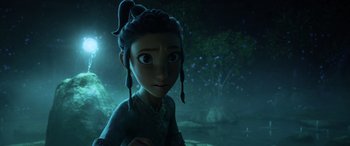 Movie still from “Raya and the Last Dragon” (2021), directed by Don Hall – A young girl is standing in the dark; Medium shot, Over the shoulder angle
