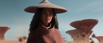 Movie still from “Raya and the Last Dragon” (2021), directed by Don Hall – A woman wearing a hat and a pink coat; Close Up shot, Over the shoulder angle