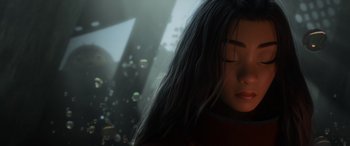 Movie still from “Raya and the Last Dragon” (2021), directed by Don Hall – A woman with her eyes closed in front of bubbles; Close Up shot, Low angle