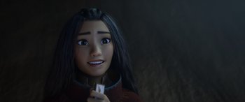 Movie still from “Raya and the Last Dragon” (2021), directed by Don Hall – A person holding something in their hand; Close Up shot, Over the shoulder angle