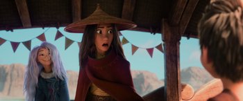 Movie still from “Raya and the Last Dragon” (2021), directed by Don Hall – A woman with a hat and a surprised look on her face; Close Up shot, Over the shoulder angle
