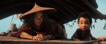 Movie still from “Raya and the Last Dragon” (2021), directed by Don Hall – A woman with a hat is laying on the ground; Close Up shot, Low angle