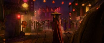 Movie still from “Raya and the Last Dragon” (2021), directed by Don Hall – A woman in a red robe and a hat walking through a crowd of onlookers; Wide shot, Over the shoulder angle