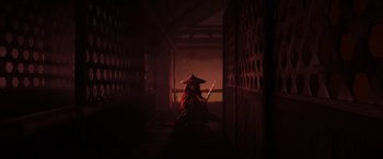 Movie still from “Raya and the Last Dragon” (2021), directed by Don Hall – A person sitting on the ground with a hat on; Wide shot, Low angle