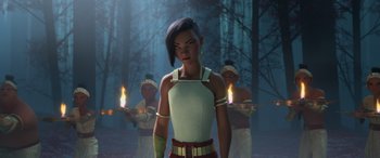 Movie still from “Raya and the Last Dragon” (2021), directed by Don Hall – A woman standing in front of a group of people; Medium shot, Over the shoulder angle