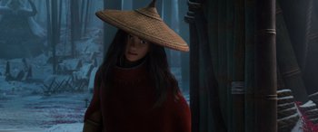 Movie still from “Raya and the Last Dragon” (2021), directed by Don Hall – A woman wearing a straw hat in a dark room; Close Up shot, Low angle