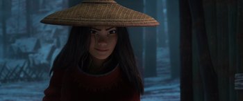 Movie still from “Raya and the Last Dragon” (2021), directed by Don Hall – A woman wearing a straw hat in the woods; Close Up shot, Over the shoulder angle
