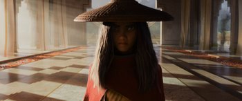Movie still from “Raya and the Last Dragon” (2021), directed by Don Hall – A woman wearing a hat with long hair; Close Up shot, High angle
