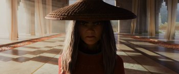 Movie still from “Raya and the Last Dragon” (2021), directed by Don Hall – A woman wearing a hat is standing in a room; Close Up shot, Low angle