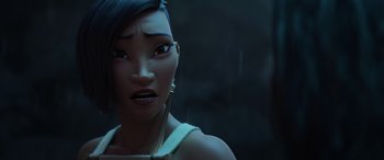 Movie still from “Raya and the Last Dragon” (2021), directed by Don Hall – A woman's face in a dark room; Close Up shot, Over the shoulder angle