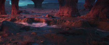 Movie still from “Raya and the Last Dragon” (2021), directed by Don Hall – A view of a rocky area with a river running through it; Extreme Wide shot, High angle