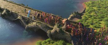 Movie still from “Raya and the Last Dragon” (2021), directed by Don Hall – An aerial view of people on a bridge over a body of water; Extreme Wide shot, High angle