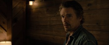 Movie still from “Raymond & Ray” (2022), directed by Rodrigo García – A person wearing a jacket; Close Up shot, Over the shoulder angle