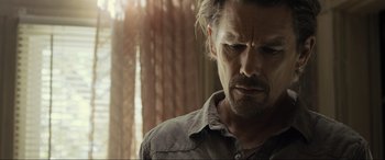 Movie still from “Raymond & Ray” (2022), directed by Rodrigo García – A person wearing a shirt; Close Up shot, Low angle