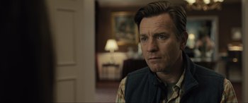 Movie still from “Raymond & Ray” (2022), directed by Rodrigo García – A person in a room; Close Up shot, Over the shoulder angle