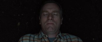 Movie still from “Raymond & Ray” (2022), directed by Rodrigo García – A person with his eyes closed; Close Up shot, Overhead angle